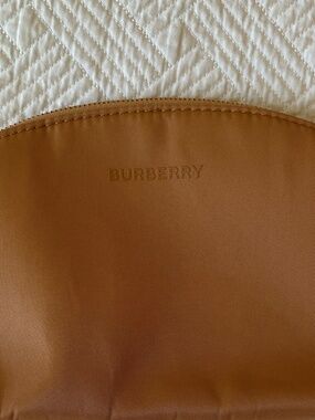 Burberry tan cosmetic pouch with gold tone zip-close and embossed BURBERRY logo